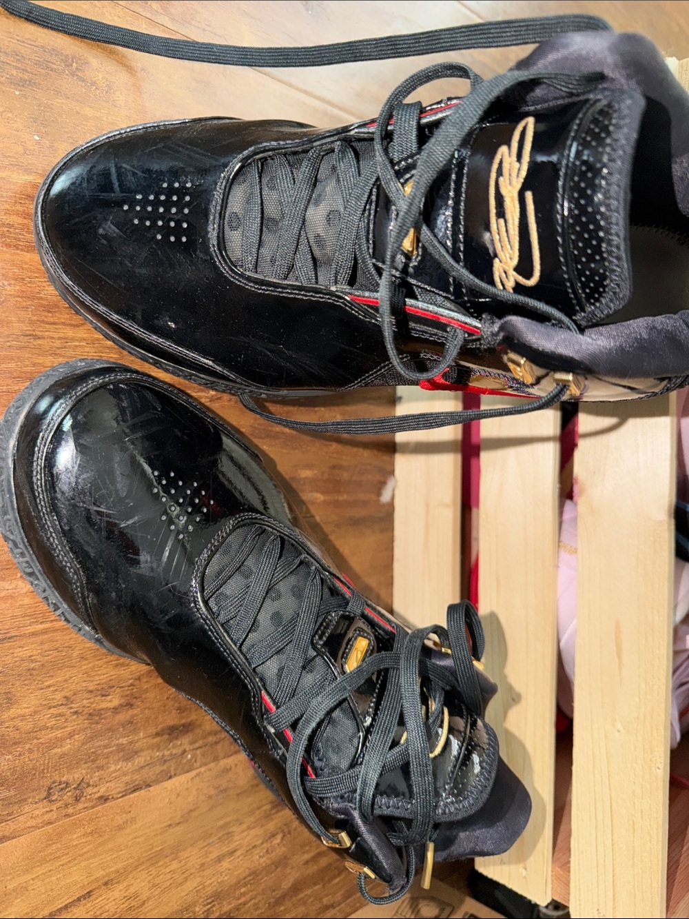 Men's Black High-Top Sneakers with Gold Detailing